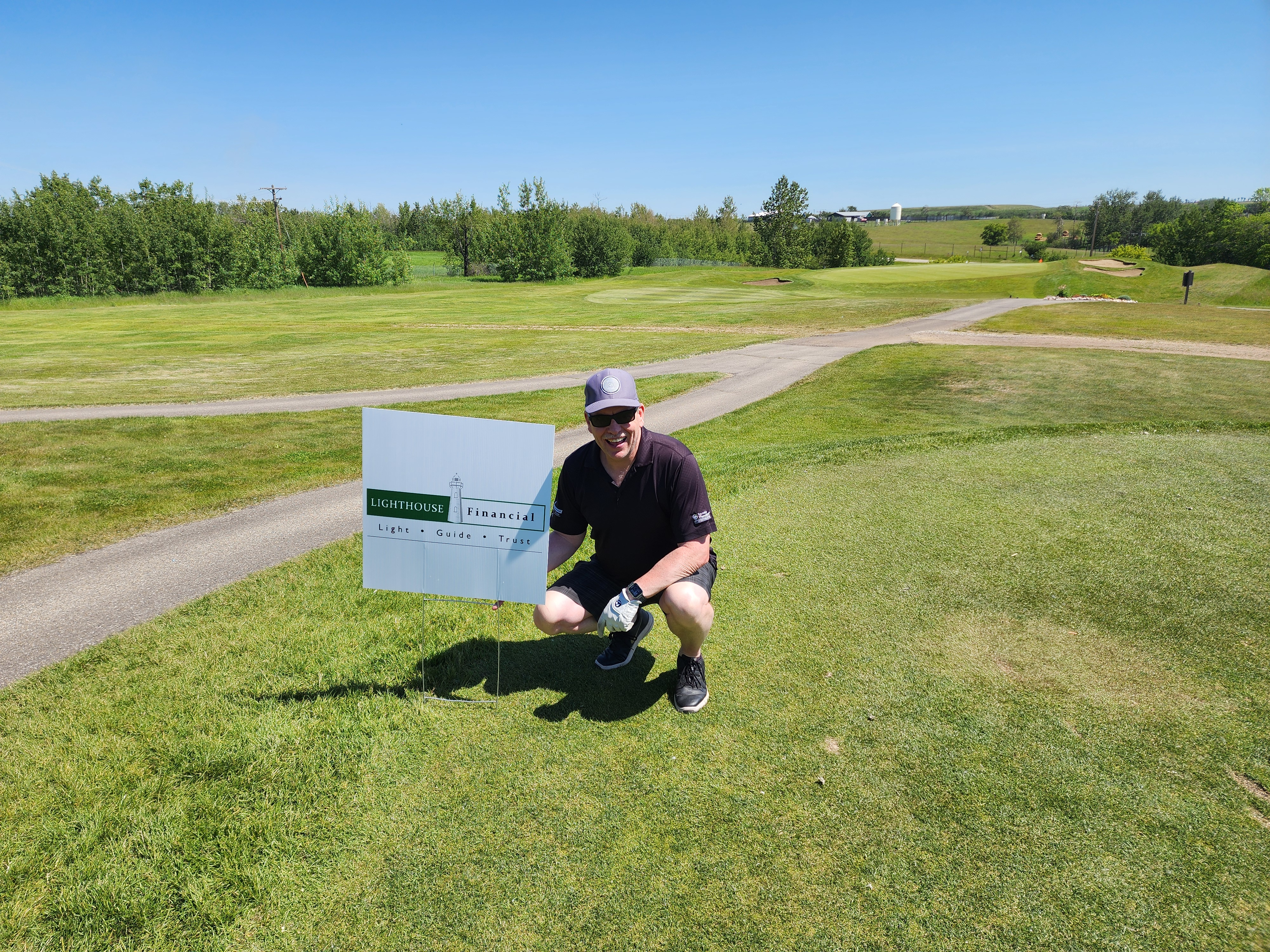 Man posing on golf course